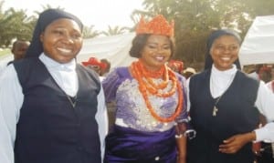 L-R: Sister Charlesmaria Emechebe  of  Holy Family Sisters of the Needy,  Okwu Uratta,  Imo State Comptroller of Nigeria Immigration Services, Mrs Racheal Uchendu and Sister Innocentia Emenogu of Holy Family Sisters of the Needy, after the  Comptroller was bestowed with a chieftaincy title by Eze David Osuagwu of Awaka in Owerri,  on Sunday.