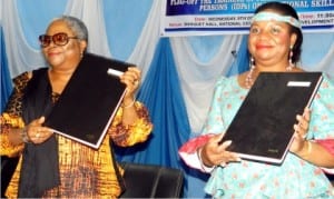 Director-General, National Centre for Women Development, Lady Onyeka Onwenu (left), with representative of United Nations High Commissioner on refugees to Nigeria and ECOWAS, Angele Dikongue-Atangana, displaying a signed Memorandum of Understanding on training of female Internally Displaced Persons on vocational skills in Abuja recently.