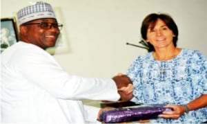 Governor Muhammed Abubakar of Bauchi State (left), presenting a souvenir to DHLVisa-Sports Leader, Sharon Abott, during the courier team's inspection of sports facilities in Bauchi, yesterday.