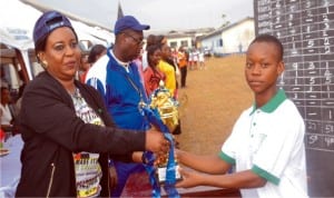 Hon (Mrs) Kpakol Sister Levula (Left) presenting trophy to senior prefect girls and Green House Leader, Holy Rossary College, Nwibari Kobani during 5th edition of Inter-House Sports competition of the college last Friday at the college premises.Pix: Nwiueh Donatus Ken 