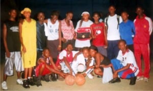 Basketball players line up before a match