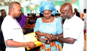 Rivers State Deputy Governor, Dr. (Mrs) Ipalibo Harry Banigo (middle), receiving an award of excellence from Akwa-Ibom People's Forum, during a Thanksgiving Service in honor of Governor Nyesom Wike for his victory at the Supreme Court. With her is Elder Ubomg Elijah (right) and Mr. Sunny Noah (left).