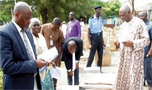 Federal Capital Territory INEC Resident Electoral Commissioner, Mr Jacob Jatau inspecting the sensitive election materials for the forthcoming Area Council elections in Abuja, yesterday.