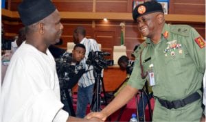 Representative of the Chief of Defence Staff, Maj.-Gen. Fatai Ali (right), welcoming the team  leader,  Miyetti Allah Cattle Breeders Association of Nigeria,  Senator Alkali Jajare, to a meeting on finding  a solution to the Herdsmen and Farmer Crisis at the  Defence Headquarters in Abuja on Wednesday