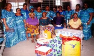 Nyemoni Iriawo Ogbo of Abonnema Akulga Rivers State in a group photograph with some elderly women, during their visit and presentation of food items, cloth to Home for the Elderly at Harbur Road on Monday.