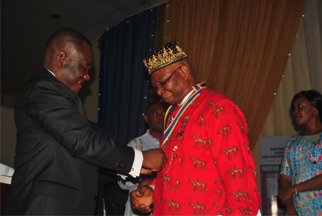 President, Rotary Club of Port Harcourt, Rtn Ferdinand Banigo (right), being decorated by former President of the Club, Rtn Harrison Dan, during the President’s induction ceremony in Port Harcourt, last Saturday.                           Photo: Obinna Prince Dele